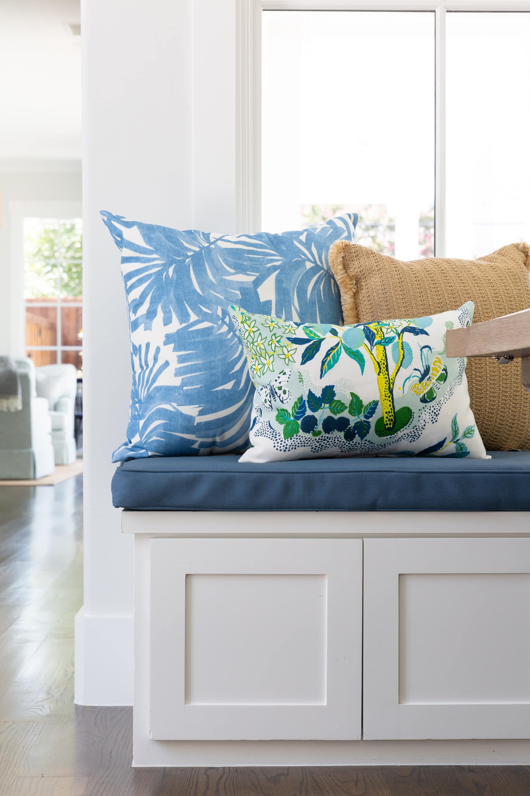 breakfast nook with a modern coastal style featuring throw pillow s