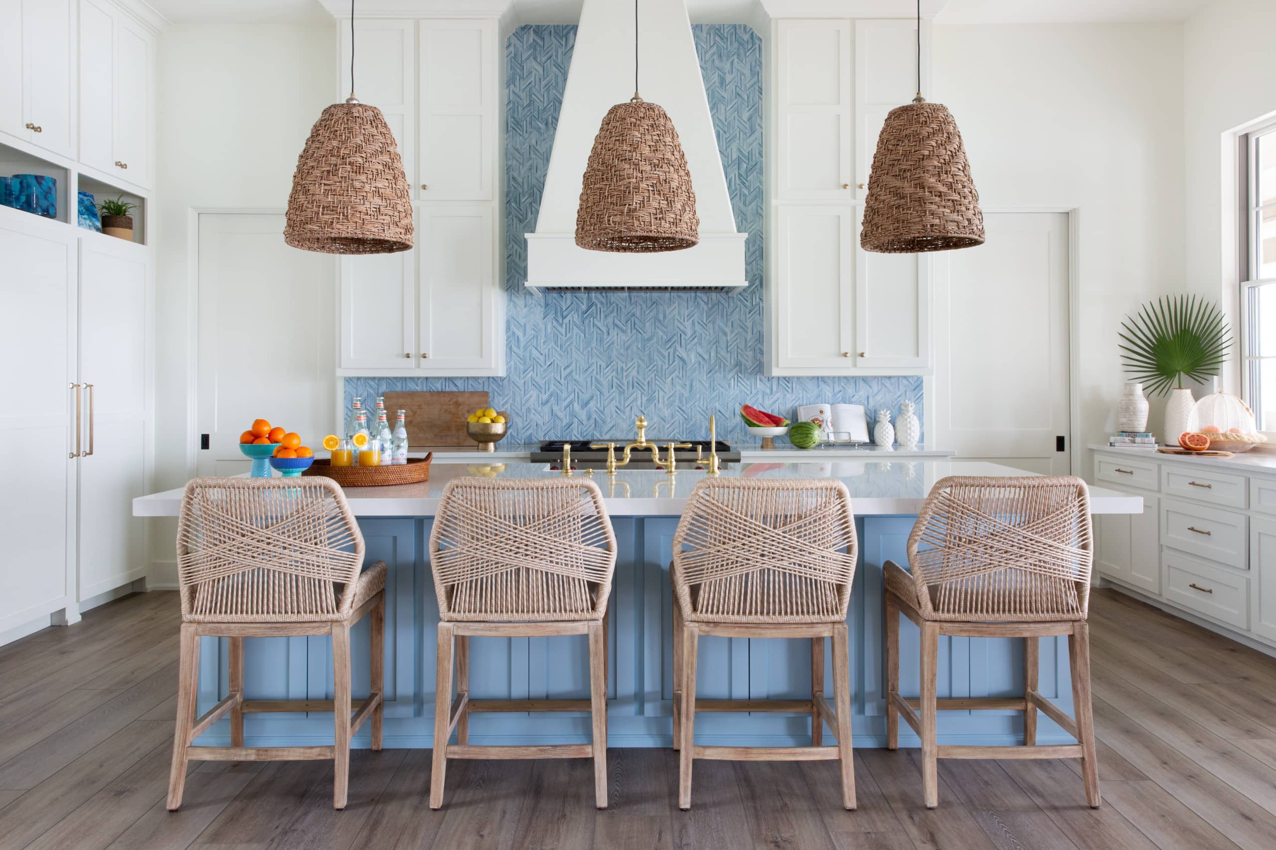 kitchen in beach house featuring a blue kitchen with rope chairs