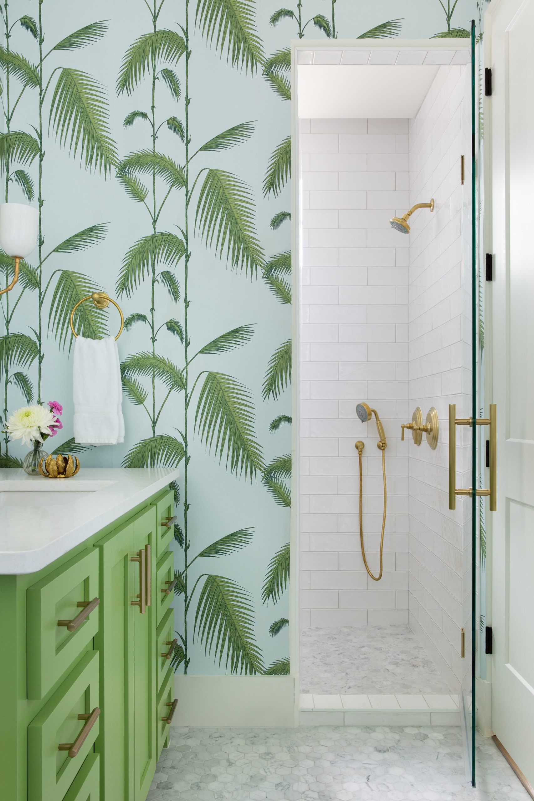 bathroom in tropical style featuring palm tree wallpaper