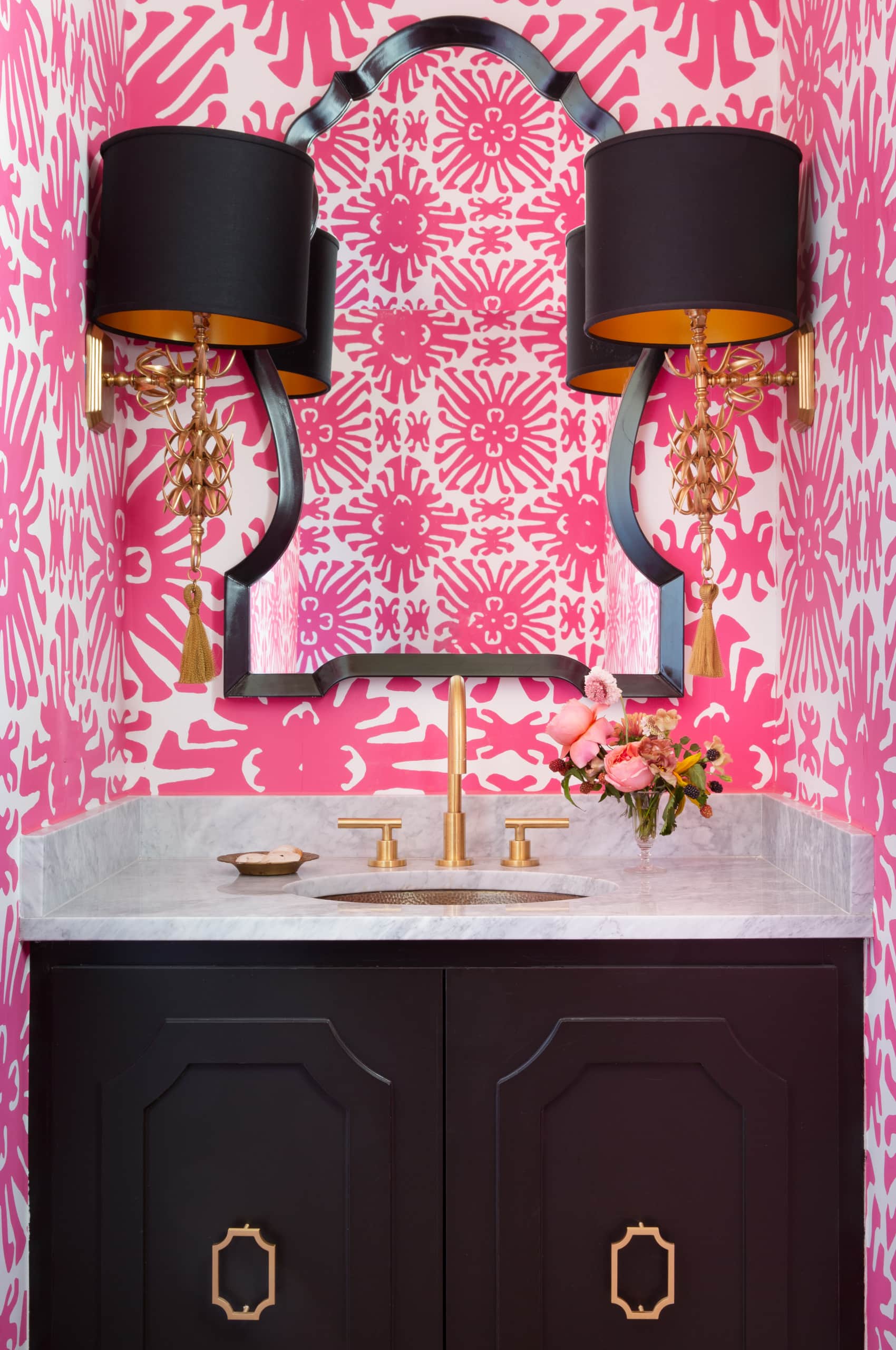 powder room featuring hot pink wallpaper and black details