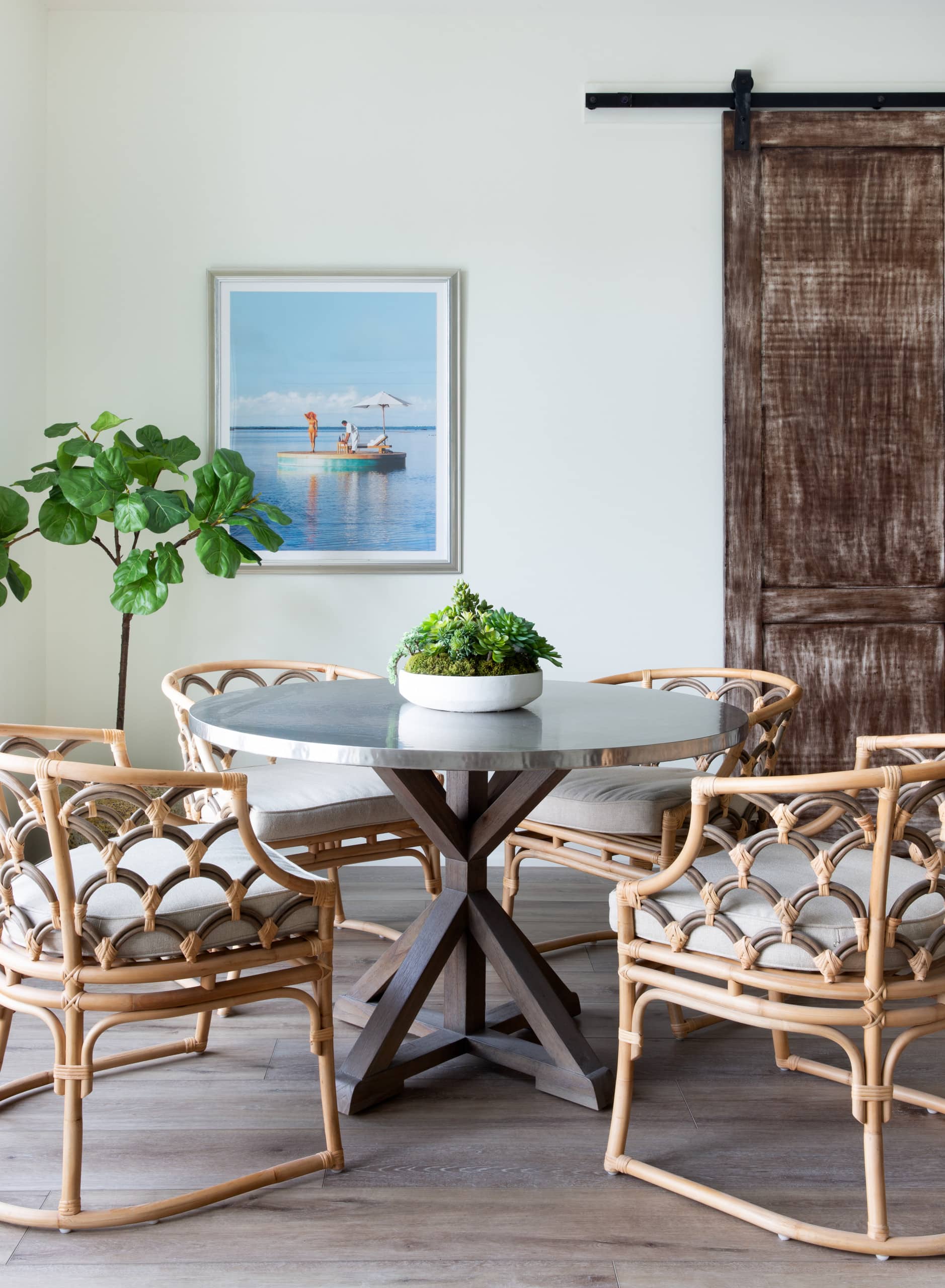 beach house room featuring round table and bomboo chairs