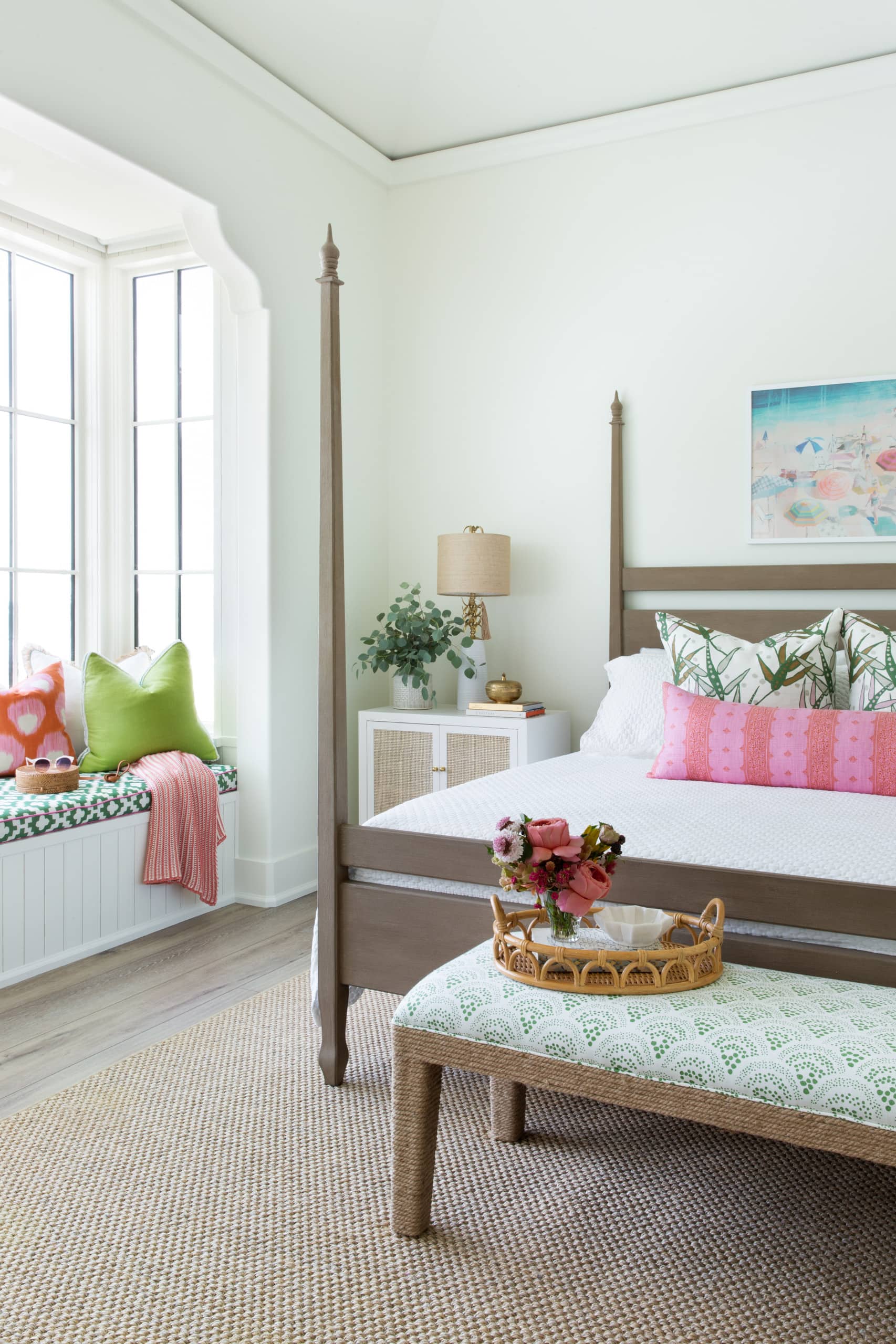 bedroom in coastal inspired decor featuring pink accents
