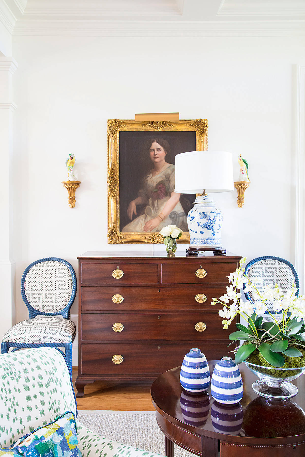 Home tour: Chest drawer in dark wood with a portrait above it