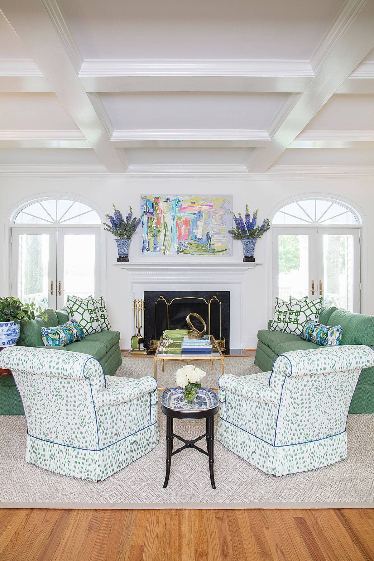 Home tour: Classic living room, coffered ceilings, cozy green couches and armchairs.