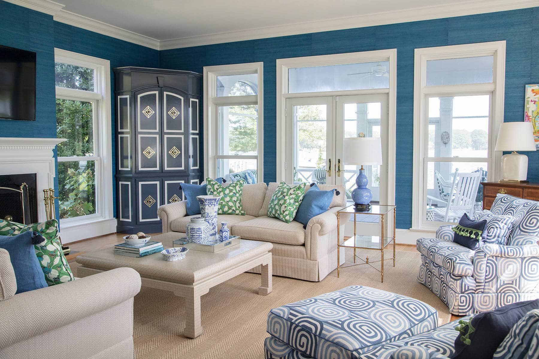 Home tour featuring living room in traditional style featuring blue walls