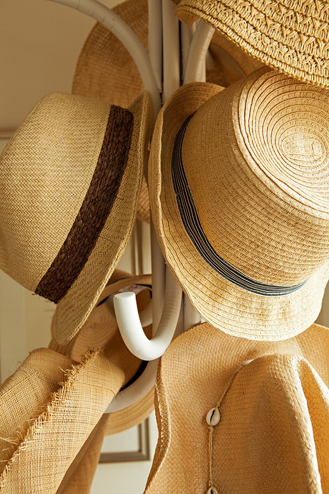 panama hats hanging from a hanger
