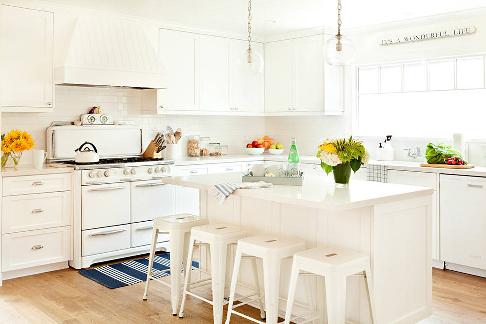white kitchen with nautical decor accents in beach coastal cottage home tour
