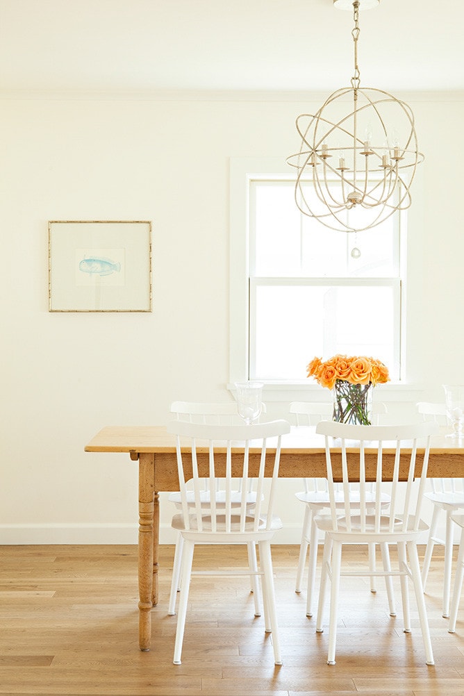 beach coastal cottage featuring dining room showing dining table with a floral arrangement home tour
