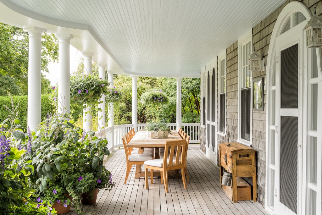 porch area with chairs and a table featured in home tour