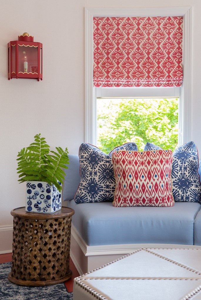 Details of sunroom featuring red and blue colors with a circus tent style ceiling in home tour
