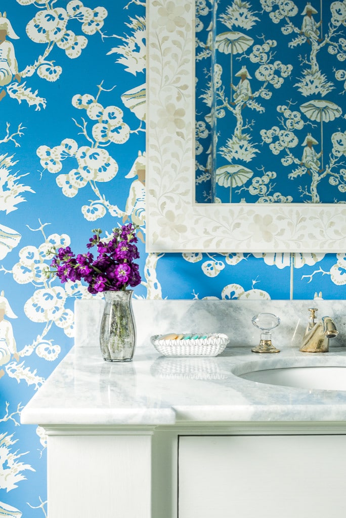 beach style bathroom featuring white and blue wallpaper in home tour