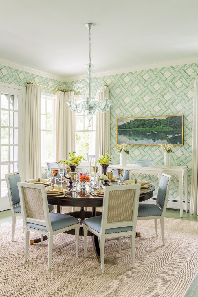 Dining room featuring green wallpaper