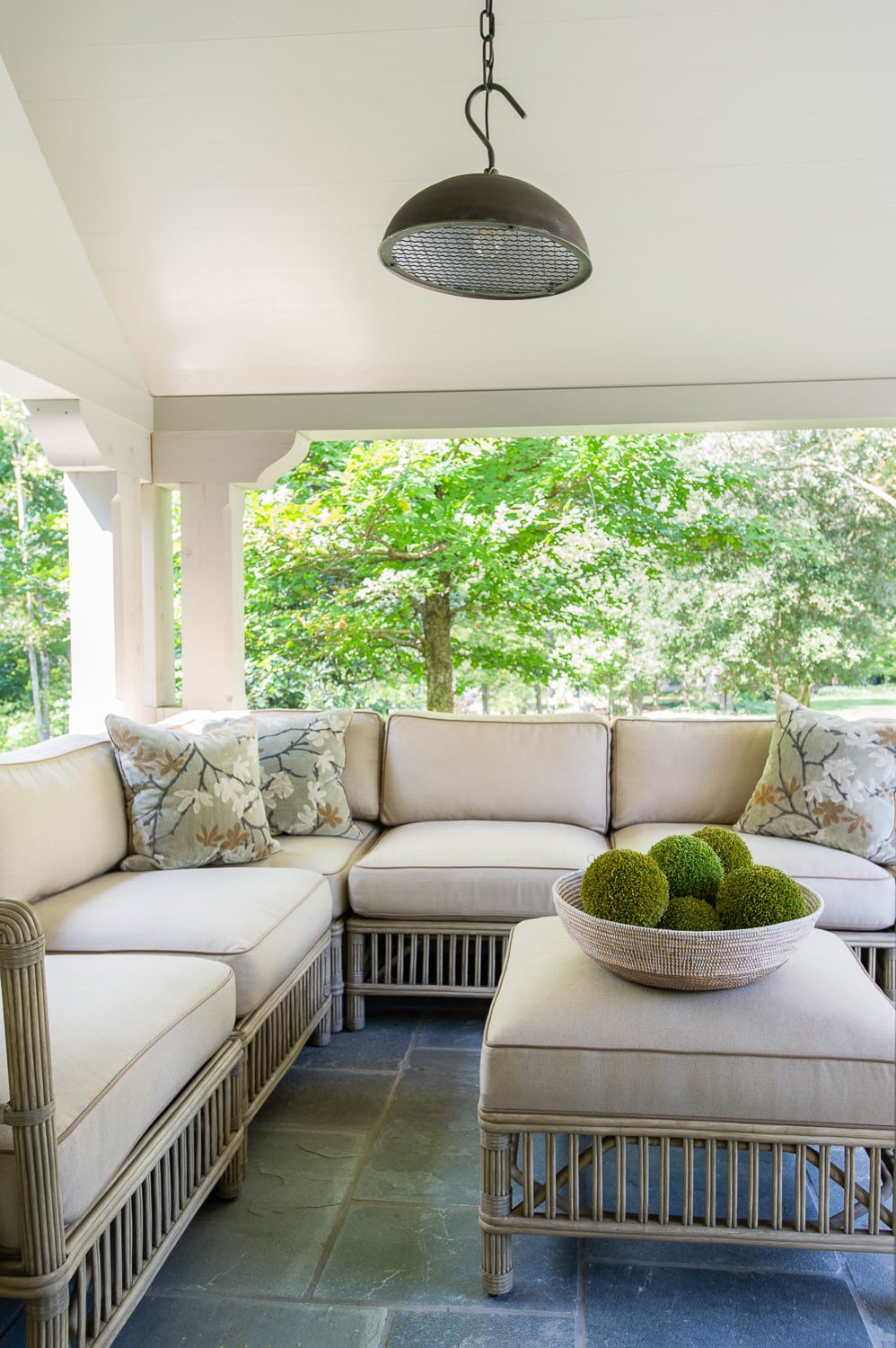 faux-rattan sofa set in traditional patio featured in home tour
