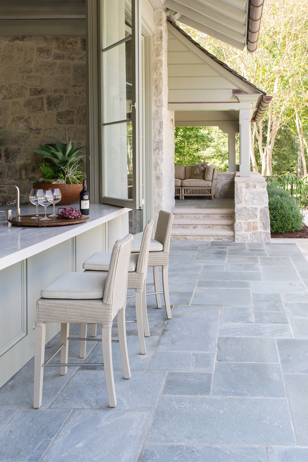 outdoor patio in traditional style featuring bar stools