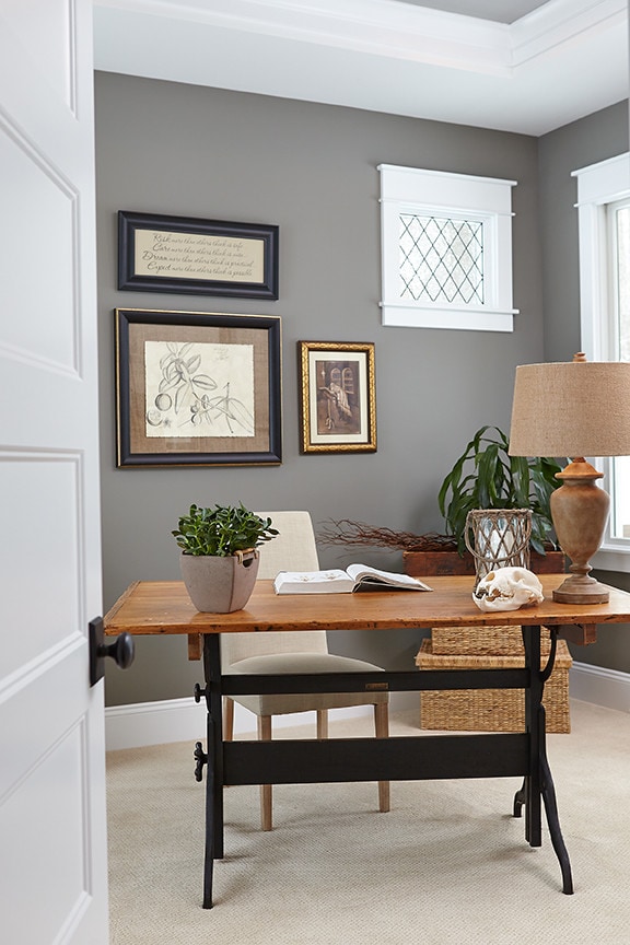 study room featuring dark gray walls featured in traditional home tour