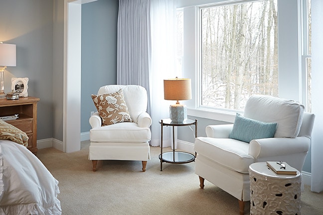 bedroom in light blue color scheme featured in traditional home tour