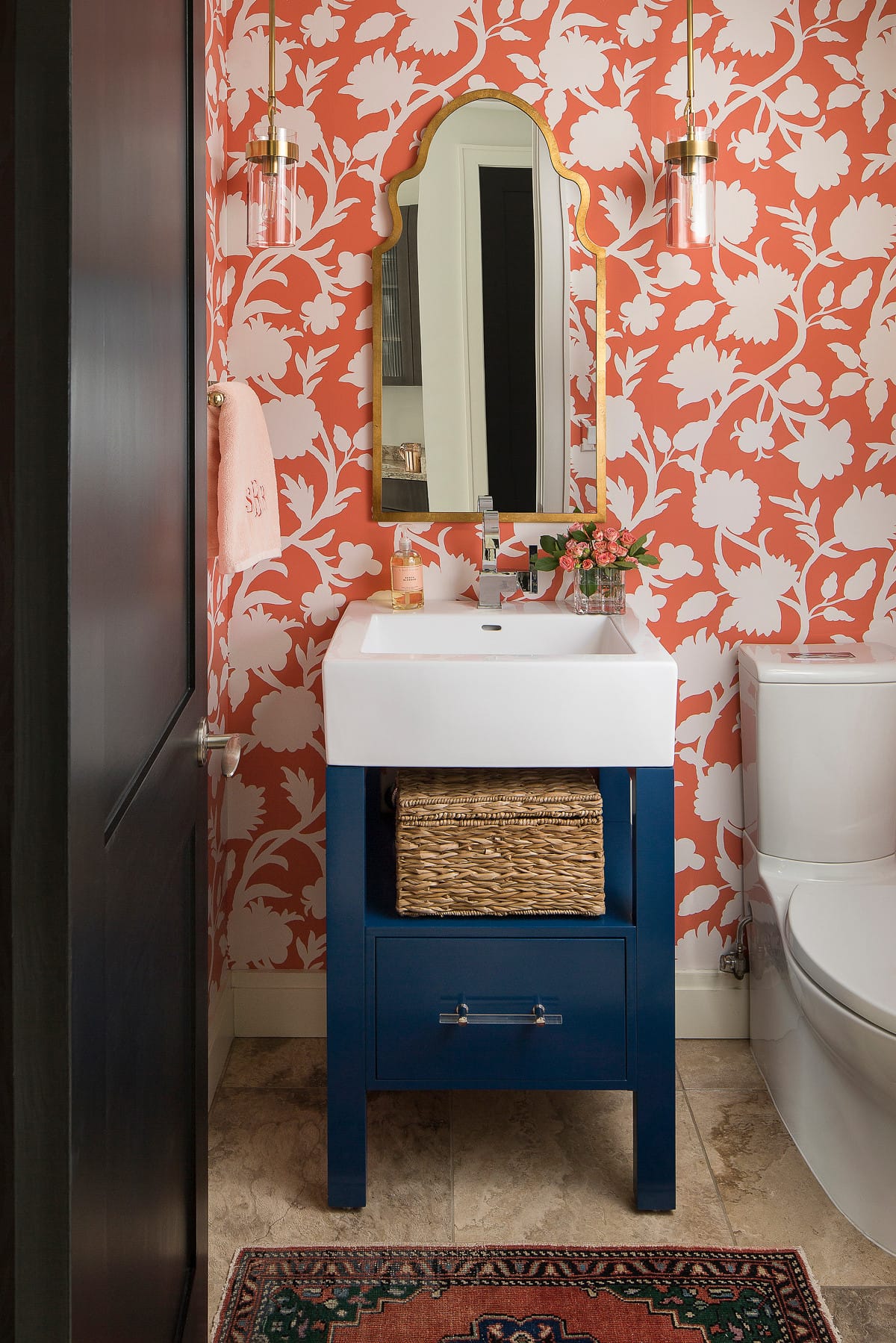 traditional bathroom featured in home tour showcasing blue cabinets
