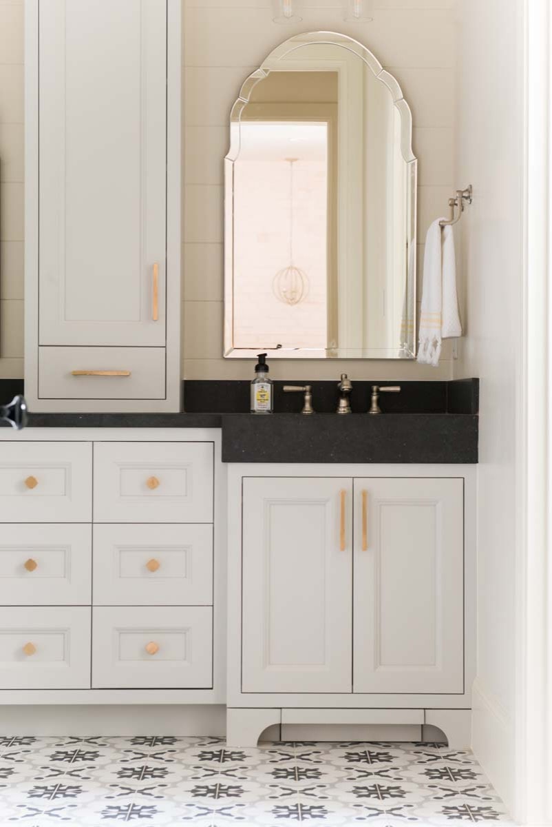 European style home tour bathroom featuring black and white vanity