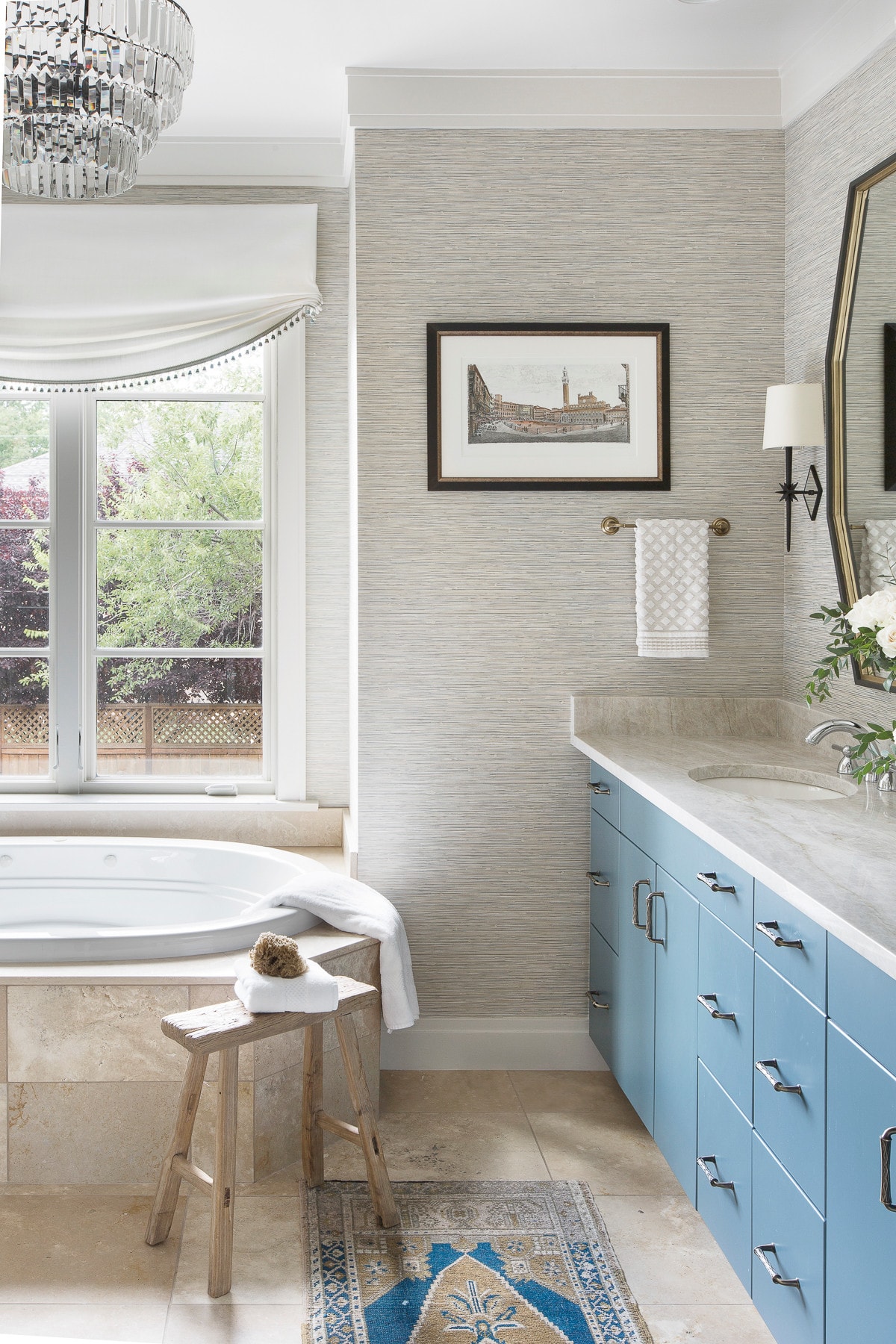 traditional bathroom featured in home tour showcasing blue cabinets