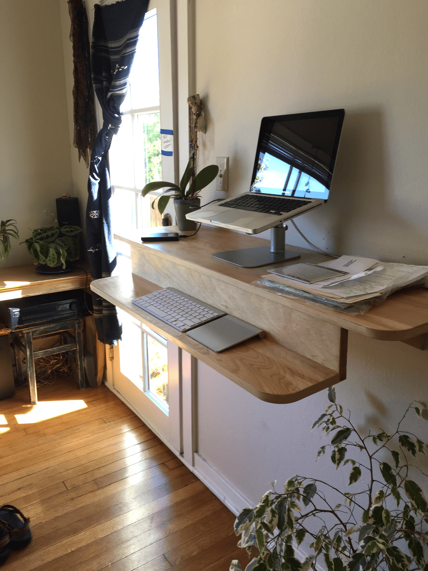 Home office workspace idea featuring a wall mounted desk