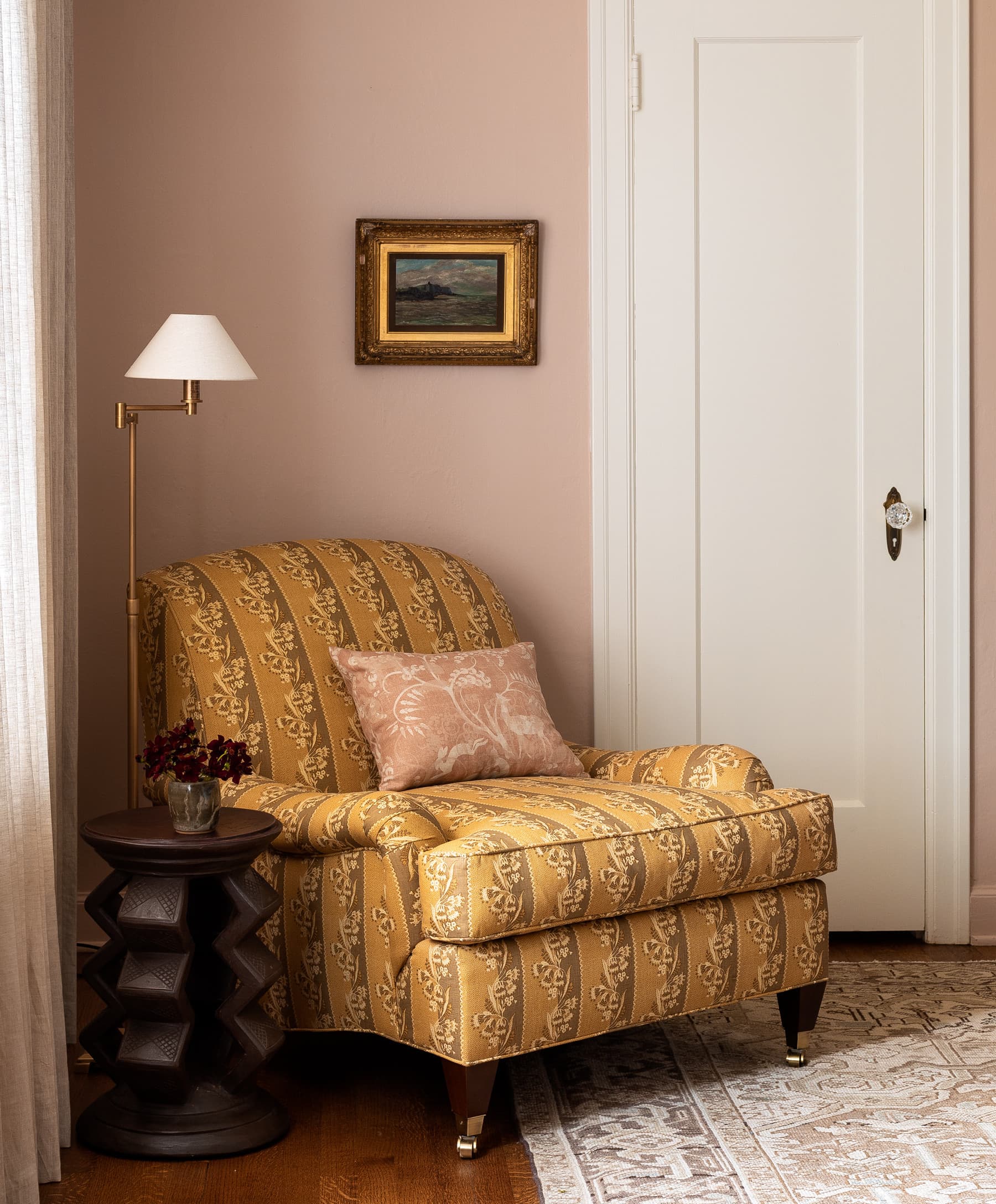 home tour featuring a vintage inspired cottage bedroom nook showcasing a armchair in retro floral patterned upholstery