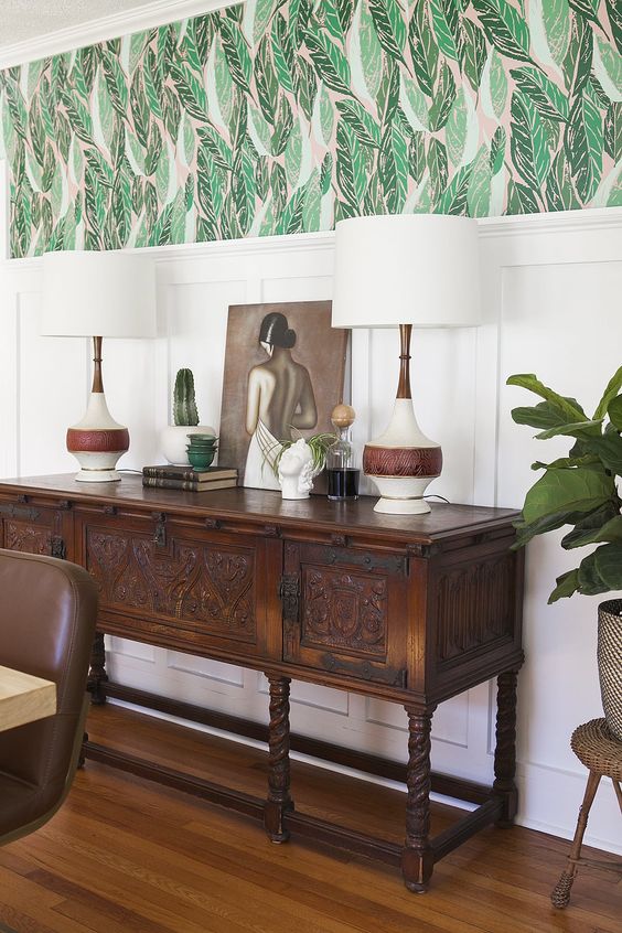 Mixing vintage and antiques in modern spaces idea featuring a antique console table in dining room