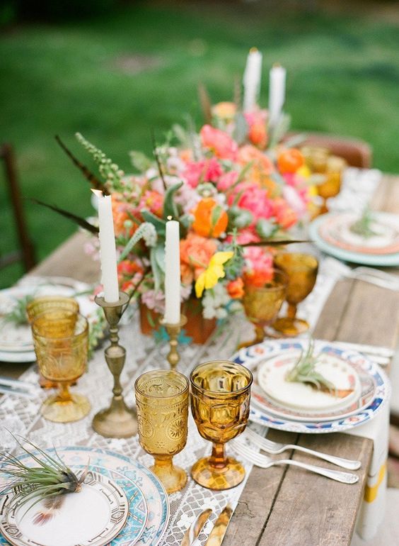 Mixing vintage and antiques in modern spaces idea featuring a mismatched table setting decor