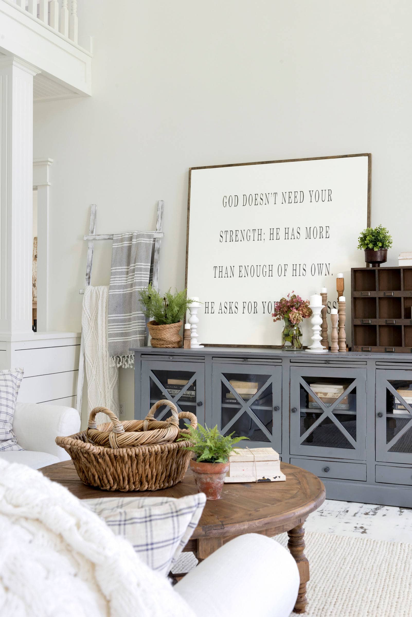 living room in farmhouse style featuring a sideboard table with farmhouse decor featured in home tour