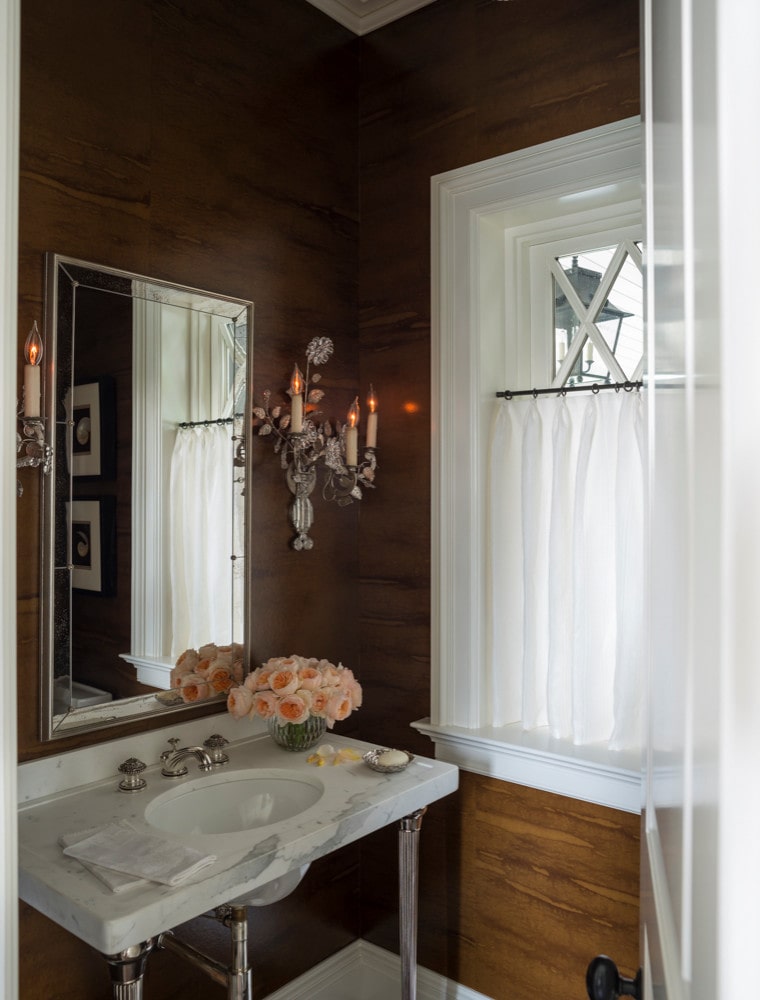 Traditional shingle style home tour featuring a powder room with cherry paneling