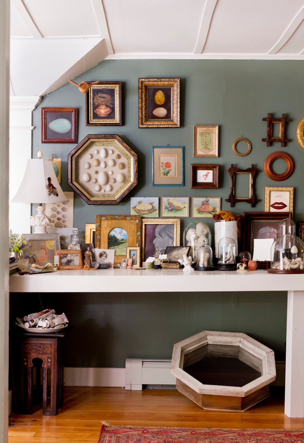 Cottage living room featured in home tour, showing a console table displaying collected items with retro and vintage elements