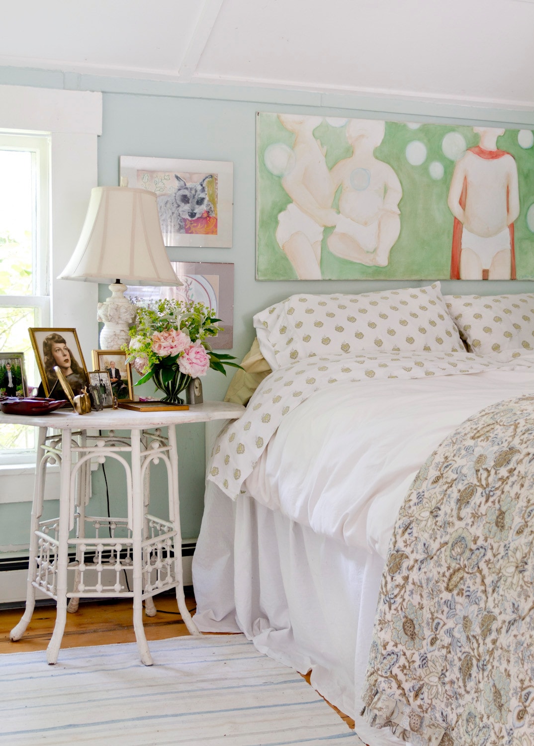 Small cottage bedroom featured in home tour, with light blue walls and coastal, traditional and romantic decor.