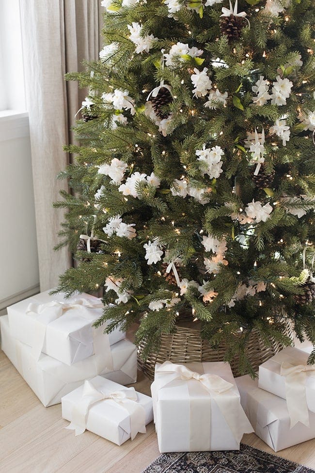 Christmas tree idea featuring white amd sparkly wrapped empty boxes around the base of the tree