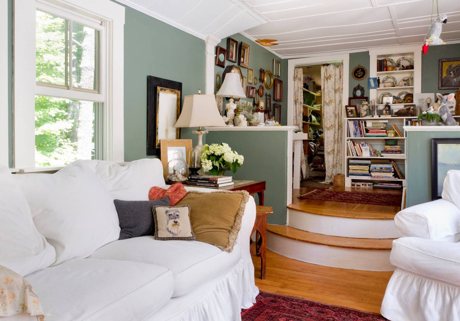 Whimsical and retro rustic style in a cottage living room featured in home tour.
