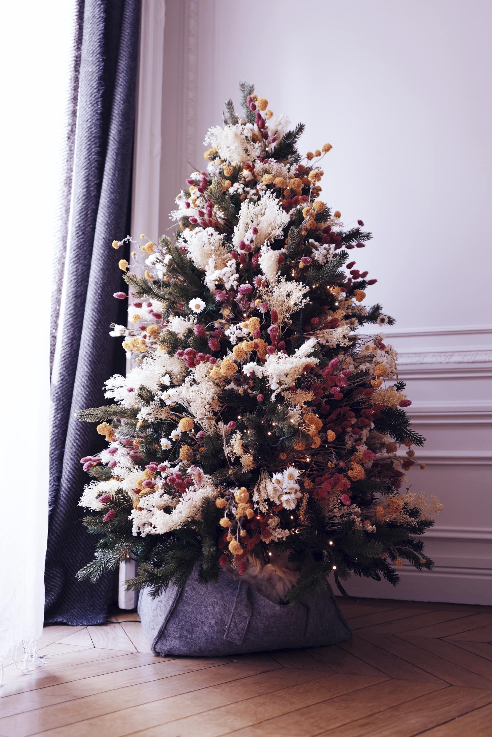 Christmas tree idea featuring a tree dorated with dried flowers