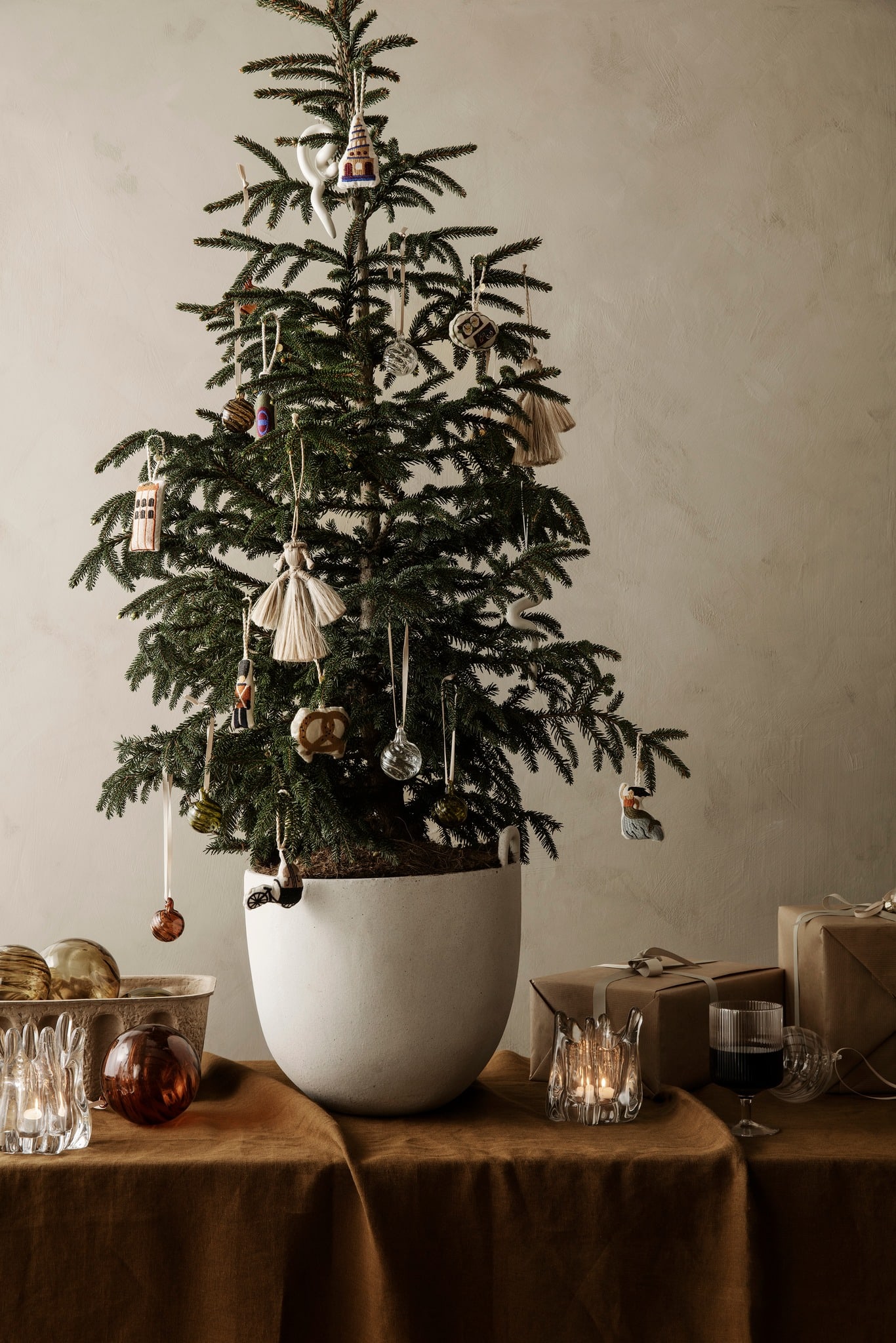 Simple Christmas tree idea featuring a minimalist and rustic tree on a ceramic pot