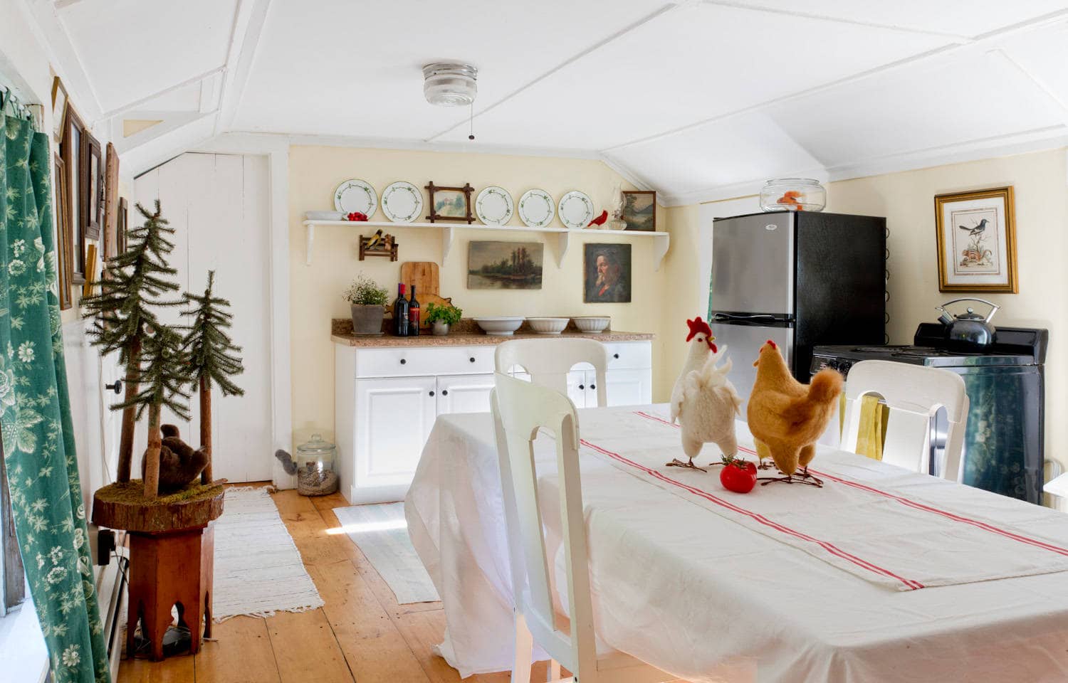 Whimsical and retro rustic style in a cottage kitchen featured in home tour, pale yellow walls.