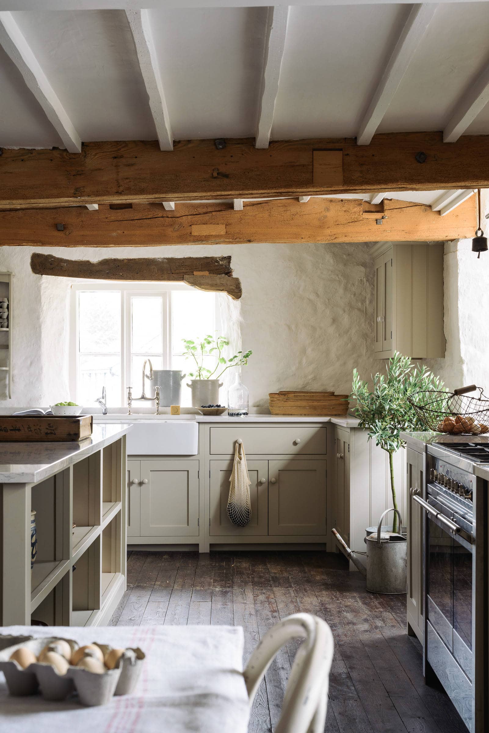 cottage-inspired kitchen featuring lime plaster walls