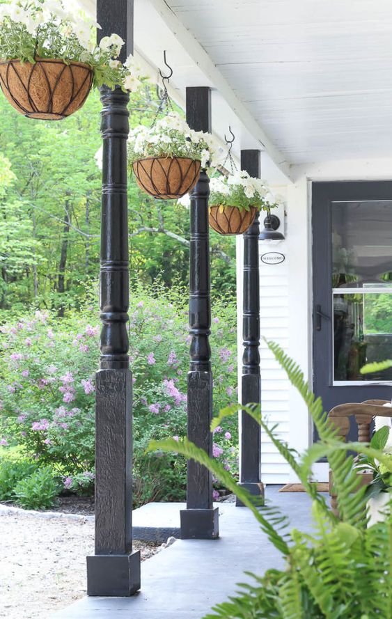 Front porch featuring hanging potted plants  outdoor decorating ideas