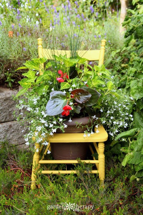 yellow chair featuring a flowers on a pot  outdoor decorating ideas