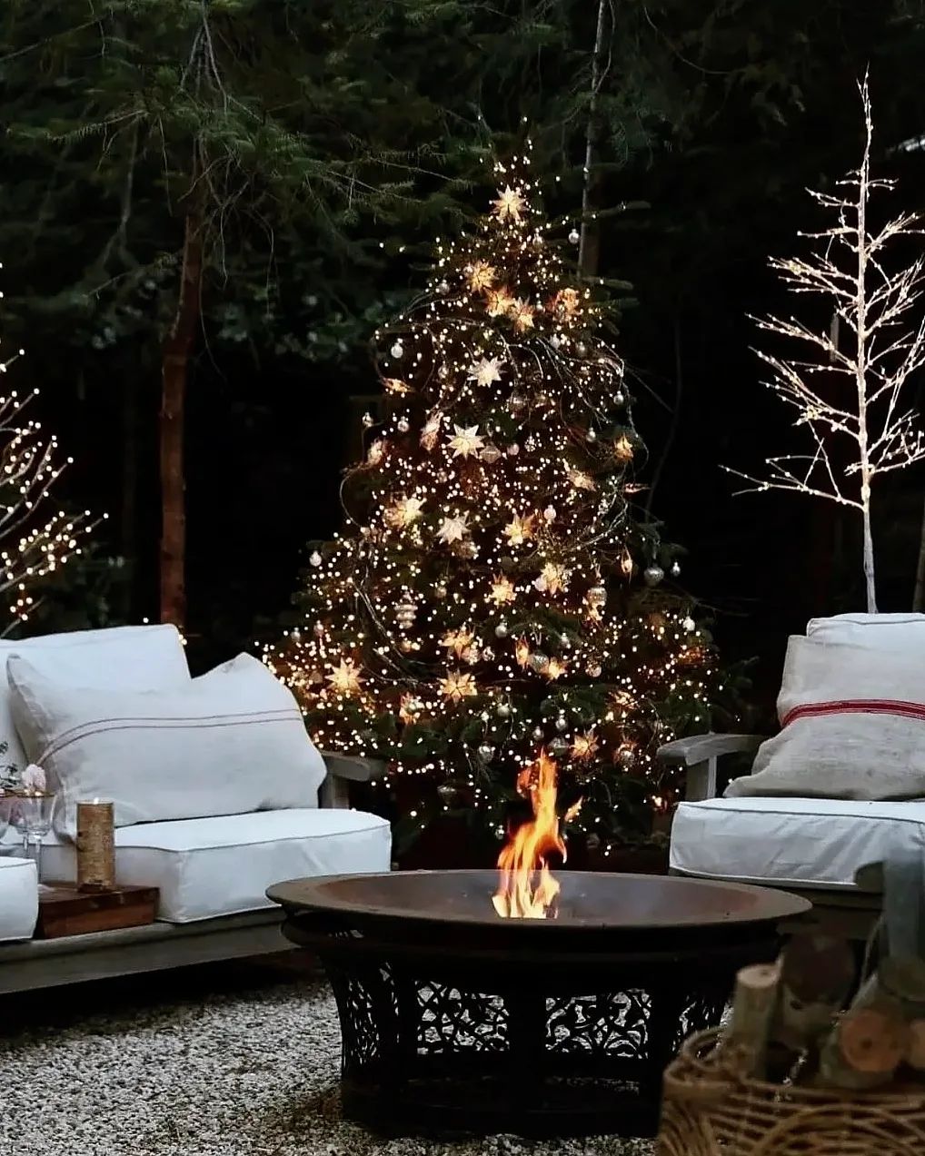 Outdoor patio featuring fire pit with chairs around it and Christmas tree featuring outdoor decorating ideas