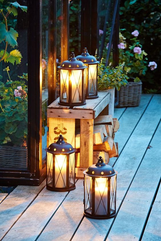 Lantern on a front porch featuring outdoor 
decorating ideas