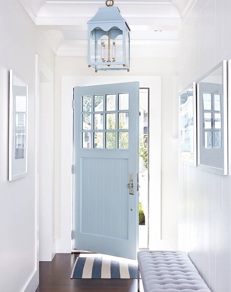 Front door entrance in light blue featuring outdoor decorating ideas