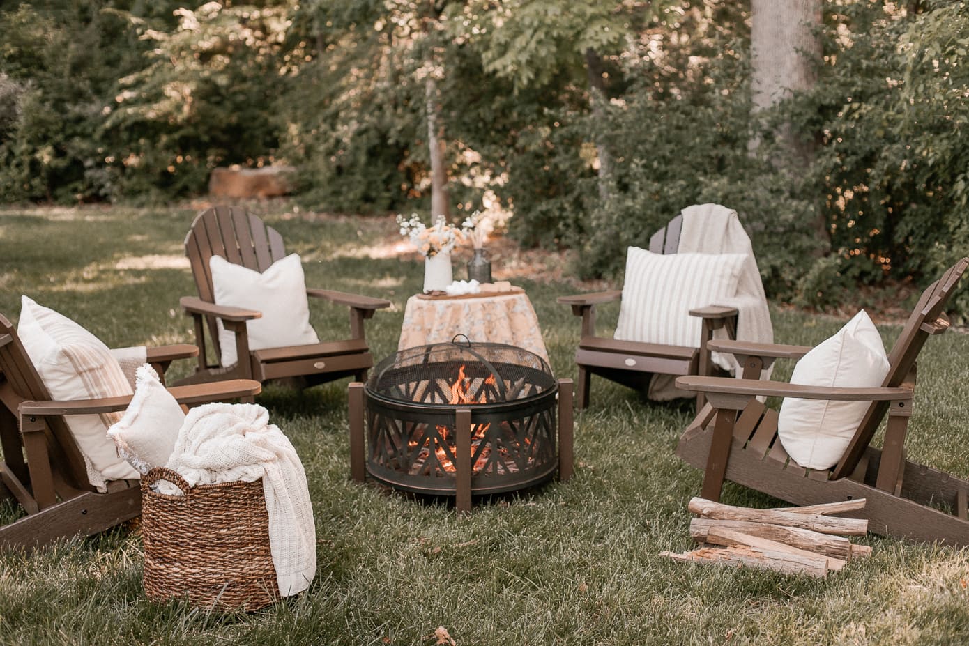 Outdoor decorating ideas featuring firepit with chairs around it
