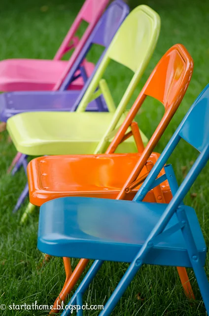 Outdoor decorating ideas featuring metal folder chairs in bright colors