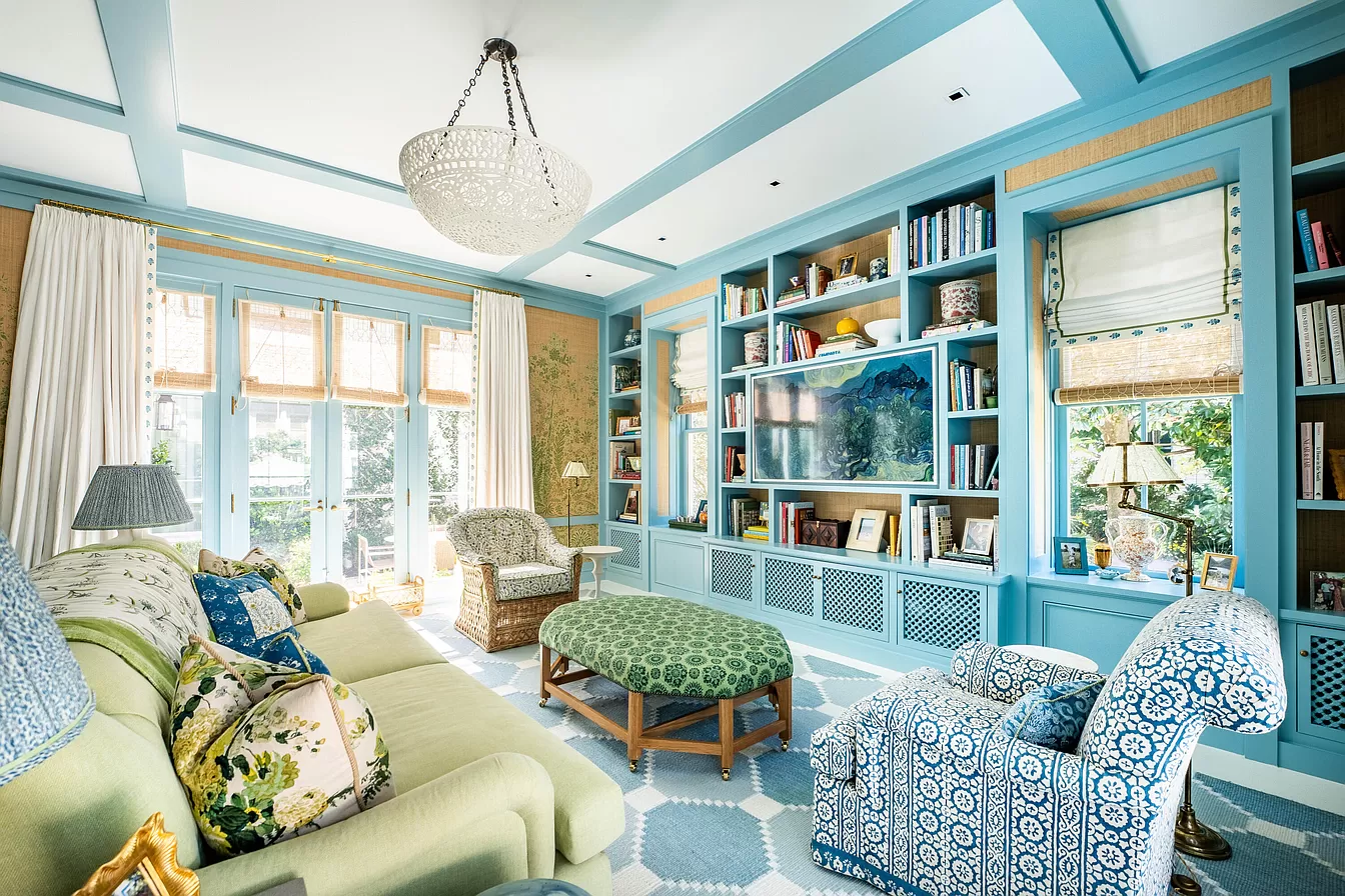 Family room traditional decor showcasing vibrant blue and green featured in Julia Berolzheimer home tour