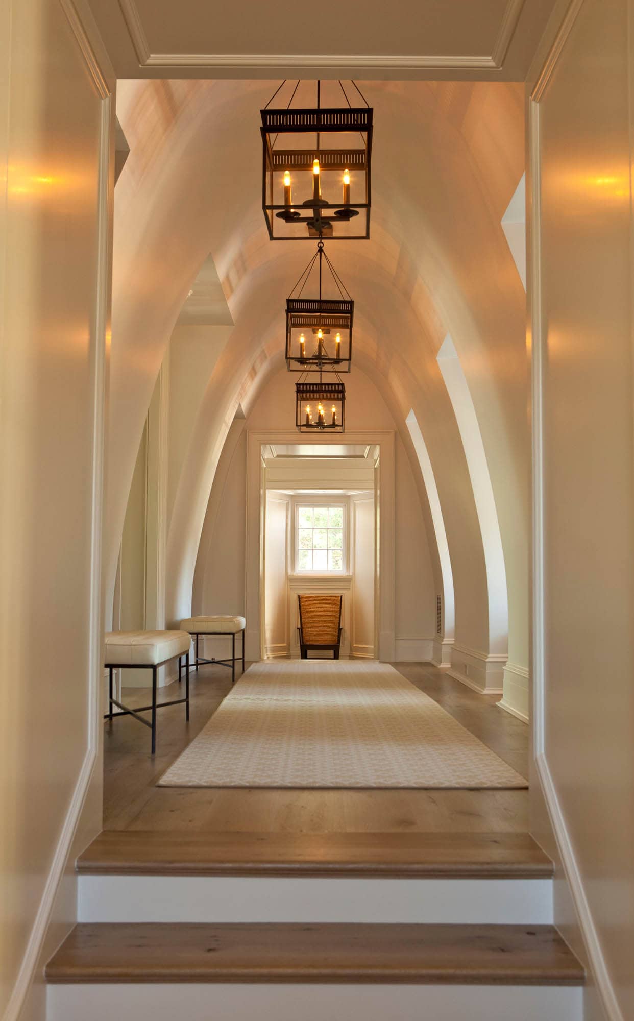 Hallway featuring arched walls in traditional style, featured in home tour