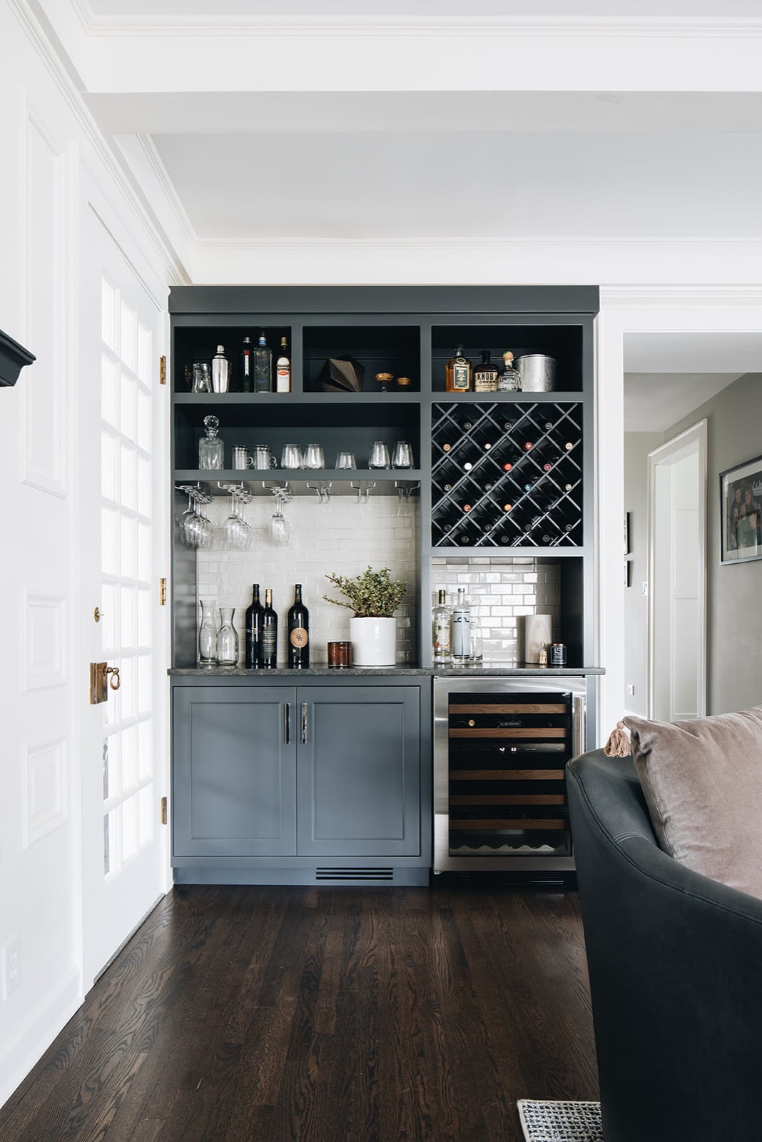 Home tour featuring family room with a wine bar in dark blue