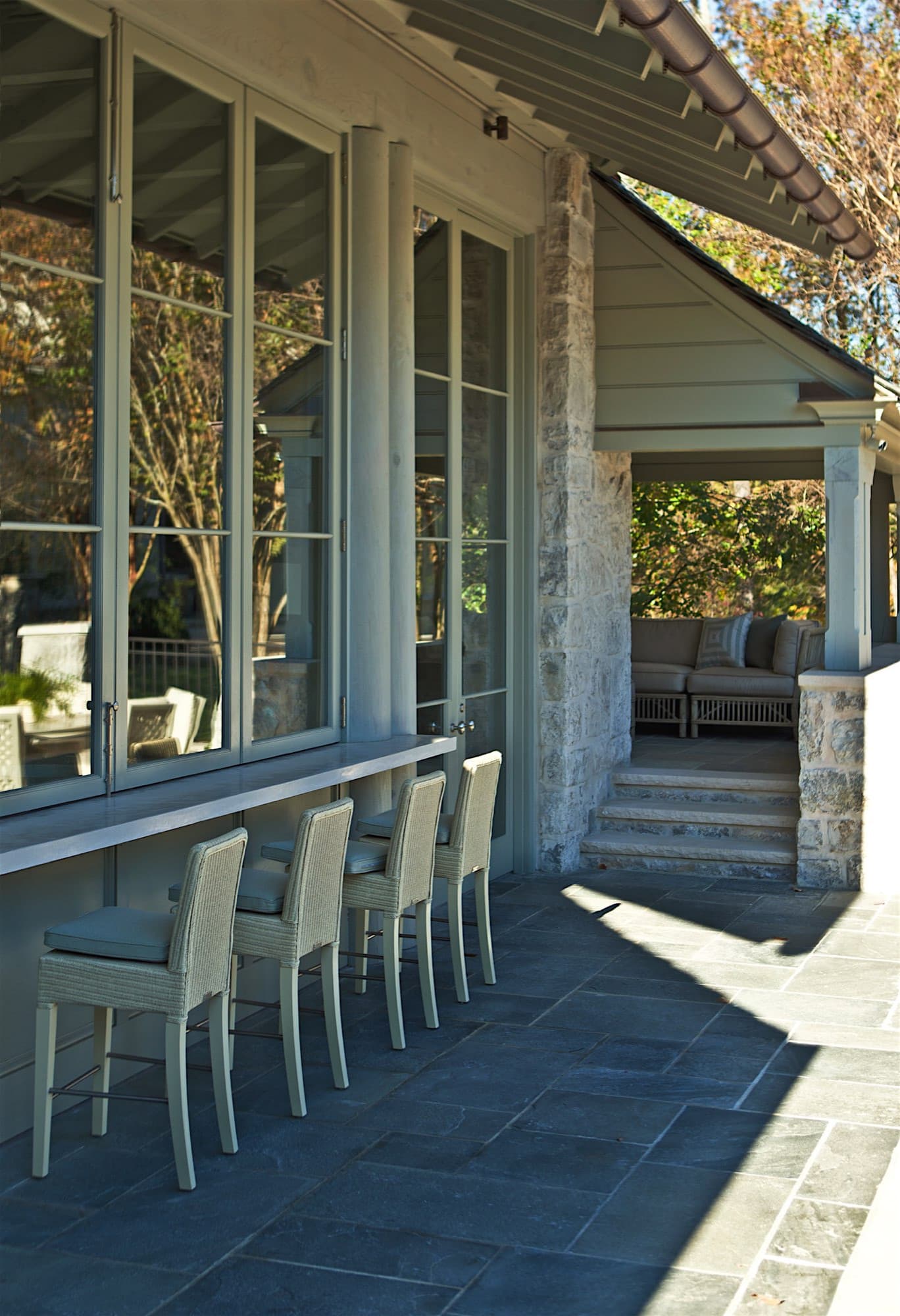Home tour featuring stone wall exteriors with traditional style.