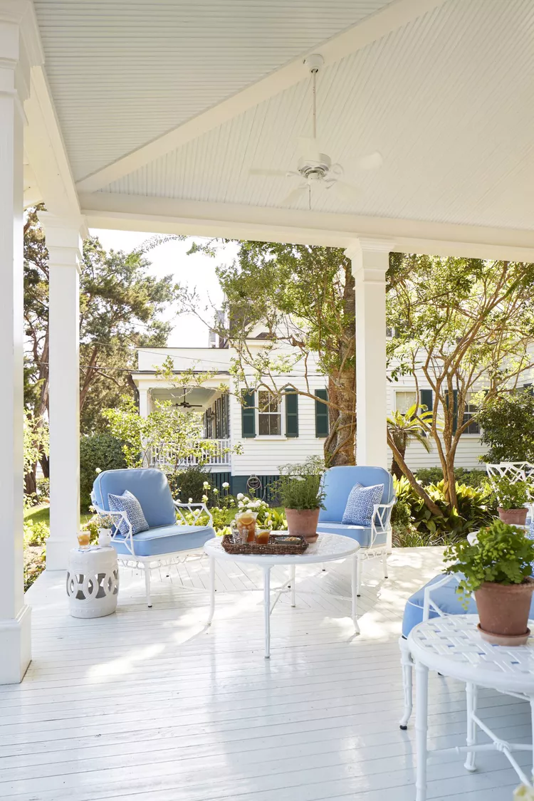 Front porch in white and light blue featured in Julia Berolzheimer home tour