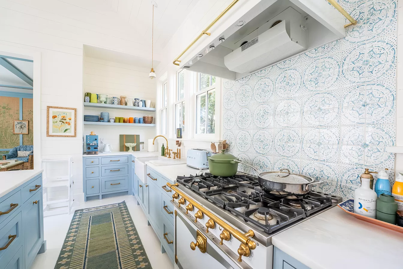 Kitchen showcasing light blue and white with traditional decor featured in Julia Berolzheimer home tour